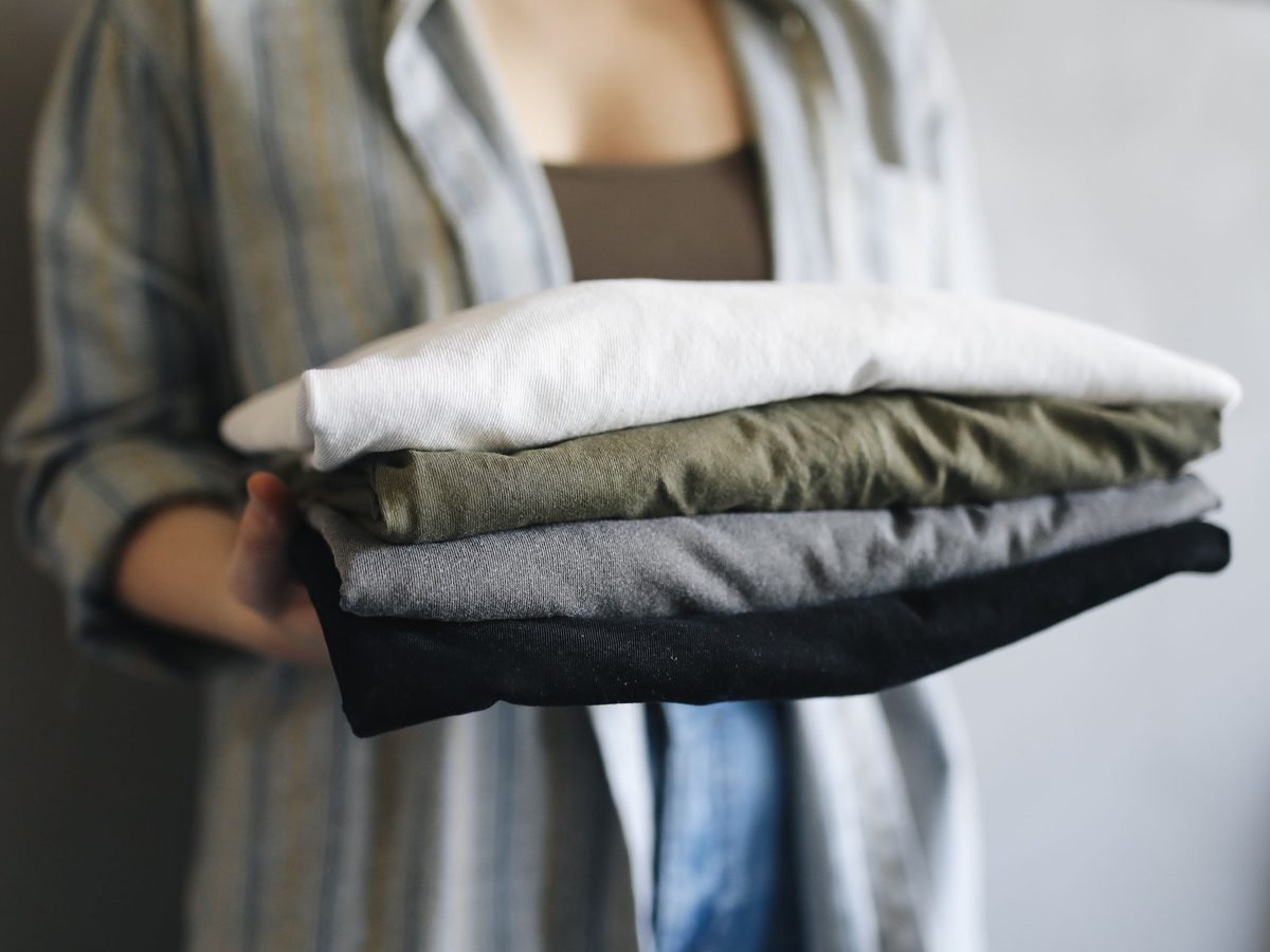 A stack of freshly folded clothes, ready to hand back
